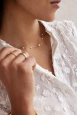 Collar de acero con corazones y perlas artificiales