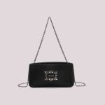 Bolso_de_mano_con_detalles_de_joyera_1.jpg
